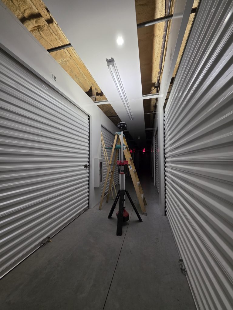 picture of ladder and light stand in storage facility hallway