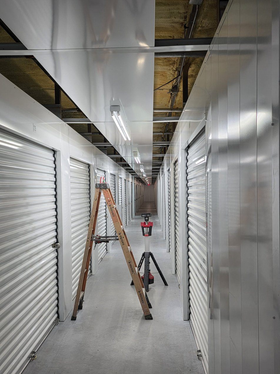 Brightly lit interior corridor of the climate controlled storage building