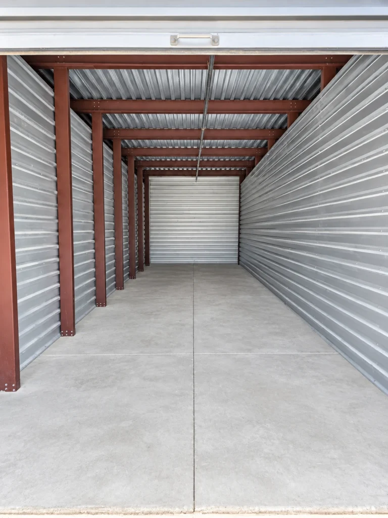 Inside an empty 10x40 non climate controlled storage unit at AAA American Storage, with steel frame and concrete floor