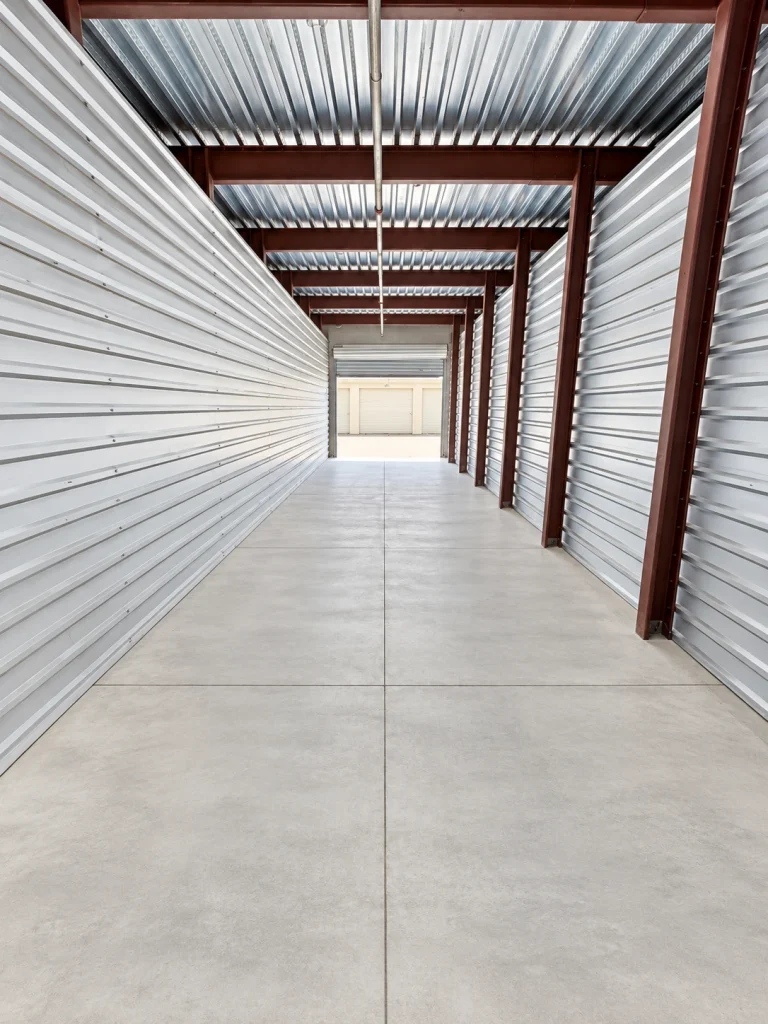 Full length view of a 10x40 non climate controlled storage unit at AAA American Storage, looking out the open roll-up door